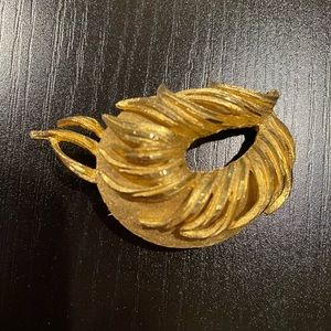 BSK gold tone brooch